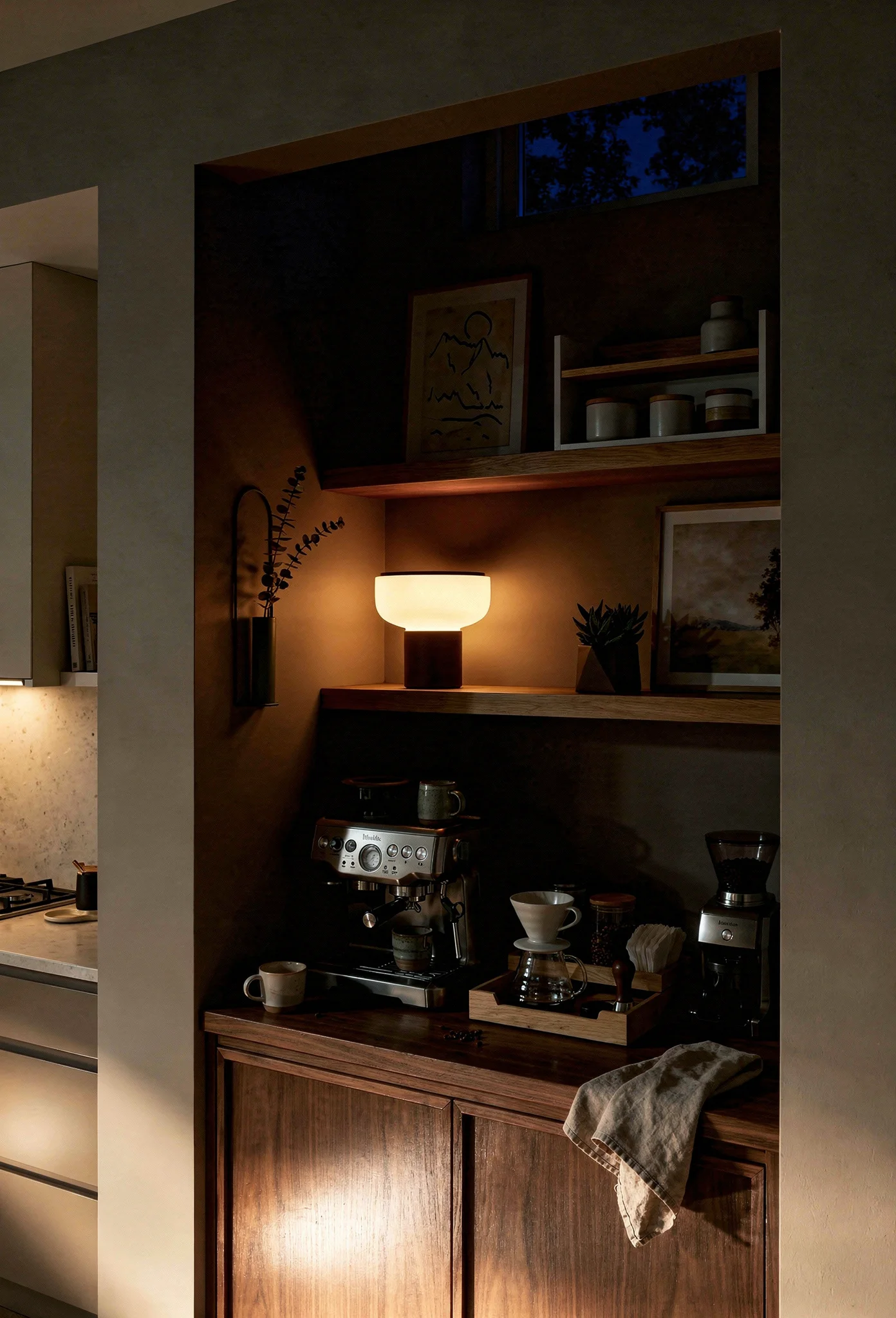 Modern kitchen evening lighting featuring walnut LED table lamp with oak shelving and mountain art